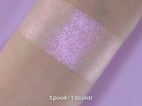 Spook-Tacular swatch on light skin against a lilac backdrop