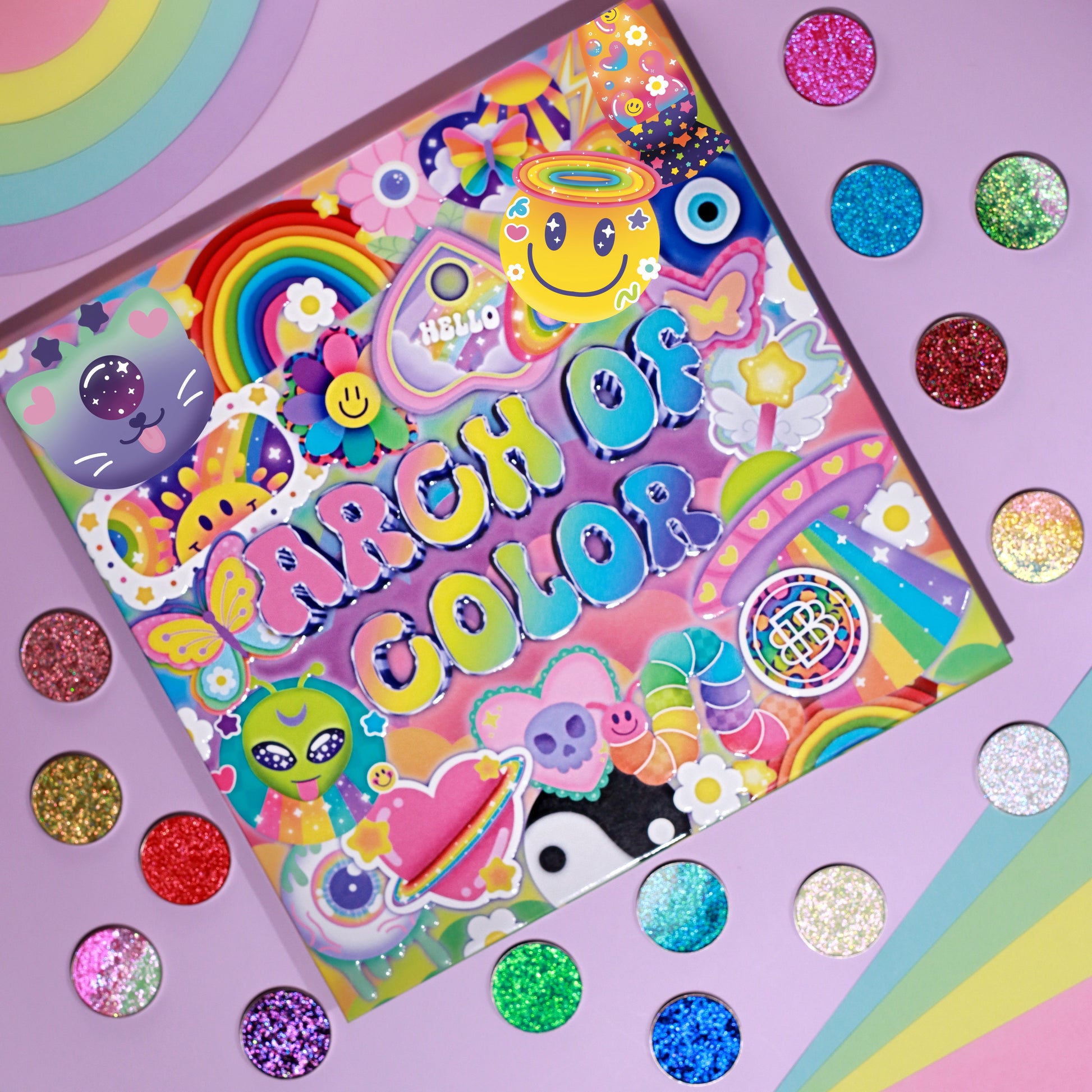 Closed Arch of Color palette flat on a pastel rainbow background, sticker collage cover facing up, surrounded by matching pressed sparkle singles