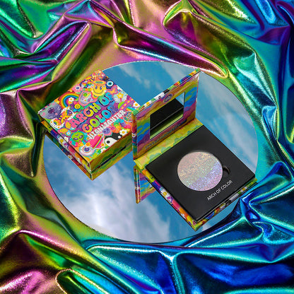 Arch of Color magnetic highlighter pan beside its refillable compact with a Y2K sticker-collage rainbow cover