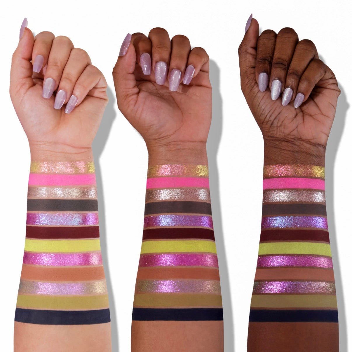 All 12 Into the Night shades swatched on three skin tones from light to deep, neon pink, lime, lilac and silver sparkles, and smoky base shades