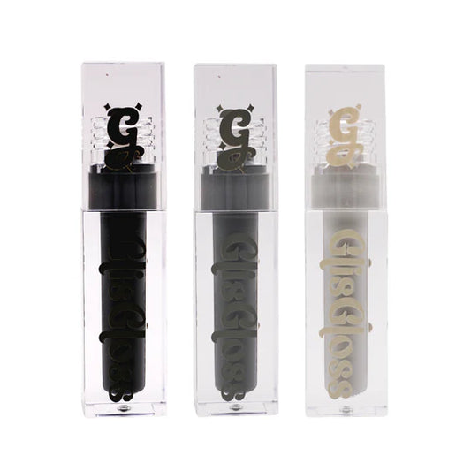 Glis Gloss by Glisten Cosmetics: three clear acrylic tubes lined up showing Liquorice black, Veil dark grey, and Grey Area light grey gloss