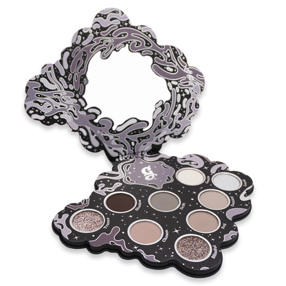 Bliss 2.0 palette open at an angle on white, mirror lid raised behind the matte and sparkly pans