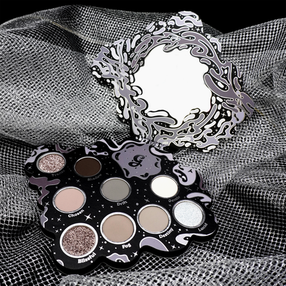 Open Bliss 2.0 palette on grey mesh fabric, mirror lid up above the nine grey pans