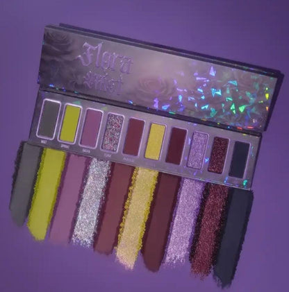 Flora Mist palette on purple with a swatch smear of every shade fanned out below the pans