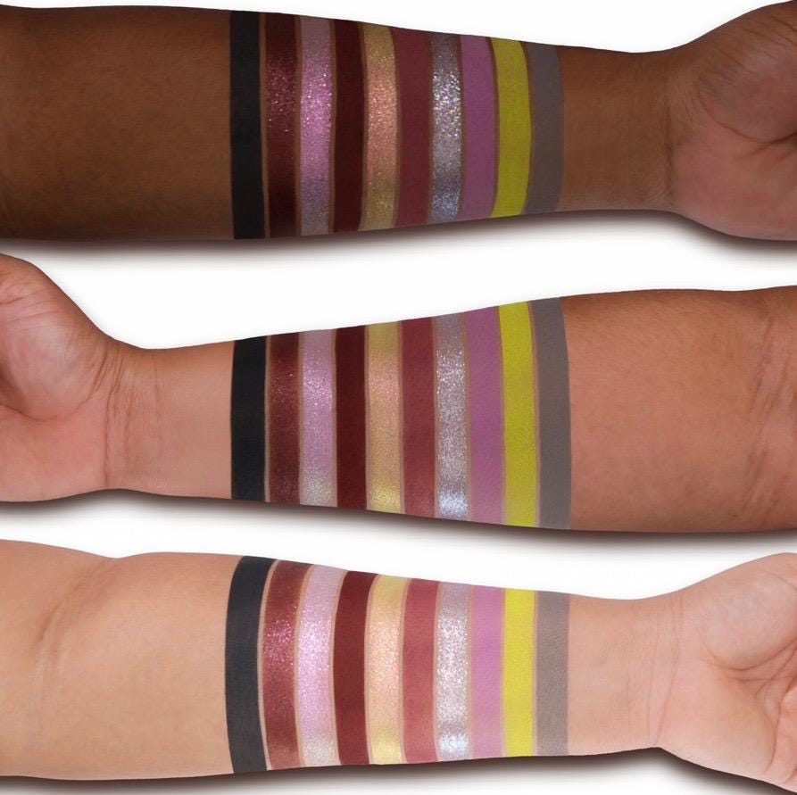All 10 Flora Mist shades swatched on deep, medium and light skin, from black and wine to mauve, silver sparkle, chartreuse and grey
