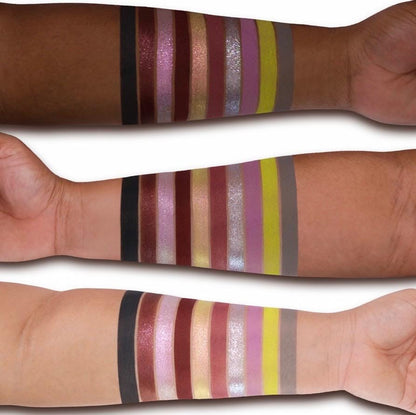 All 10 Flora Mist shades swatched on deep, medium and light skin, from black and wine to mauve, silver sparkle, chartreuse and grey