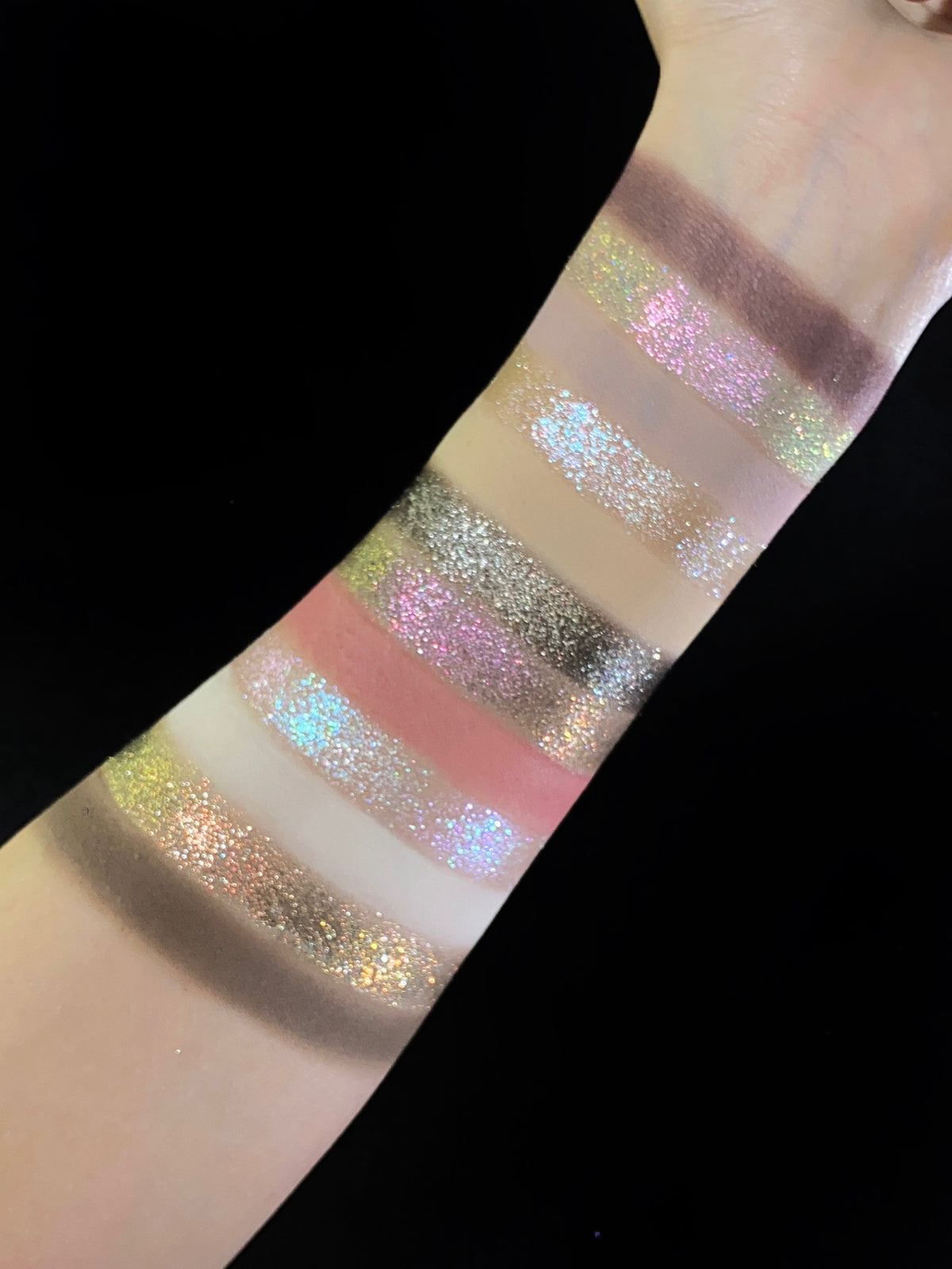 Another angle of the Pâtisserie arm swatches against black, wrist to elbow