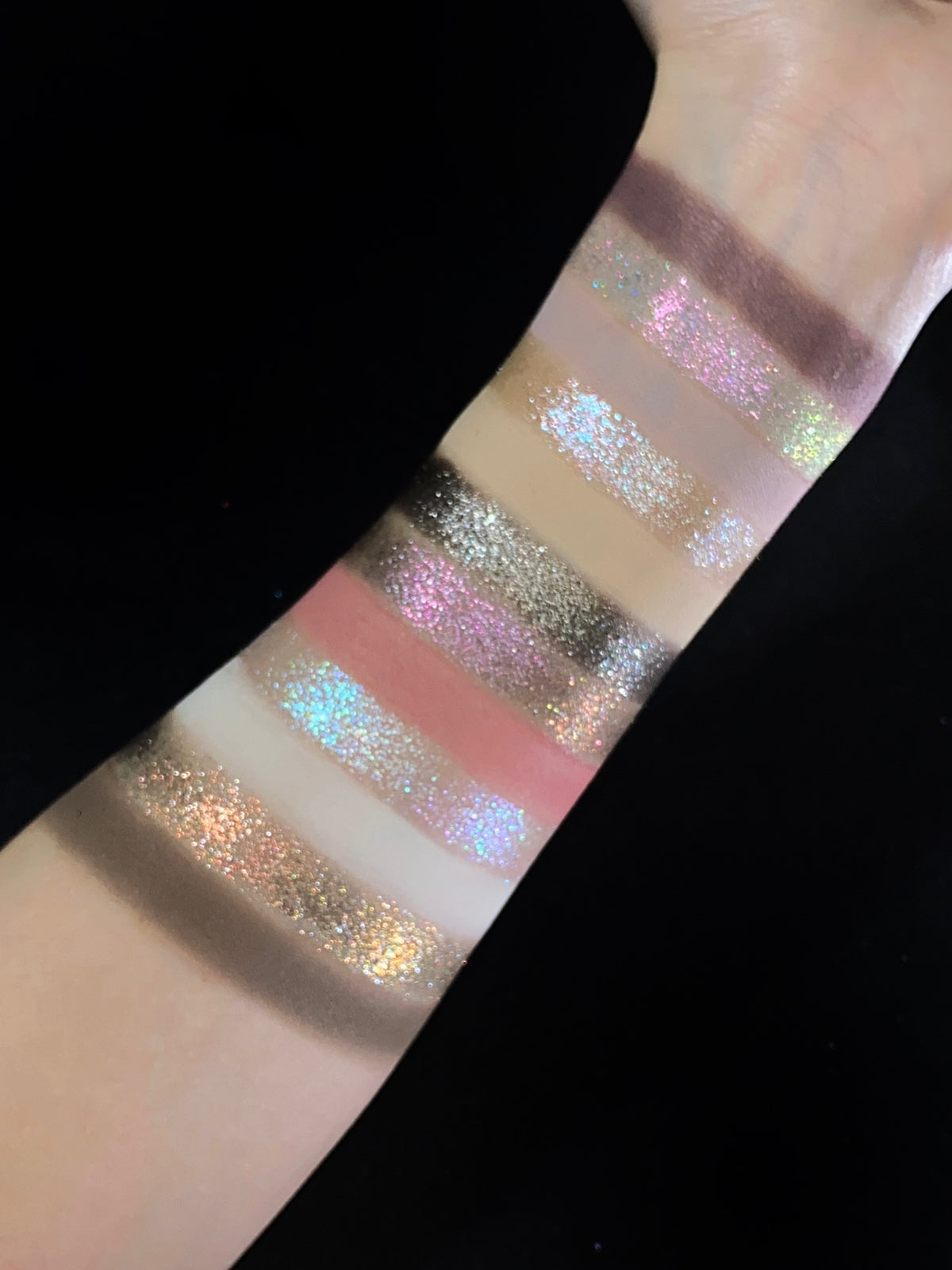 Pâtisserie arm swatches against a black background, mattes and sparkle shades in alternating stripes