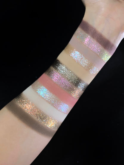 Pâtisserie arm swatches against a black background, mattes and sparkle shades in alternating stripes