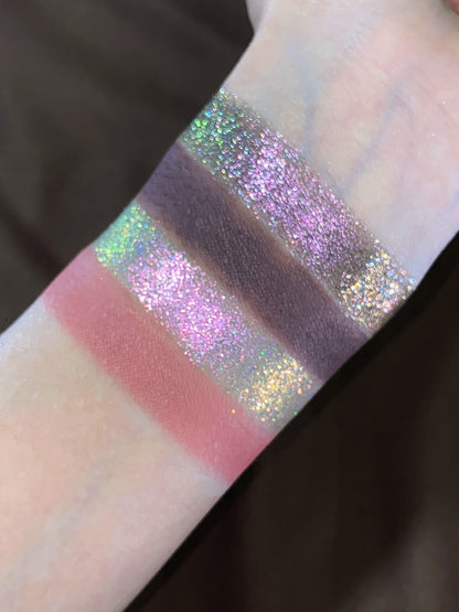 Close-up swatches: dusty rose and plum mattes between pink and green sparkle shades