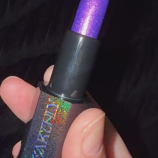 Final Cut bullet turned in the hand to show its violet sparkle