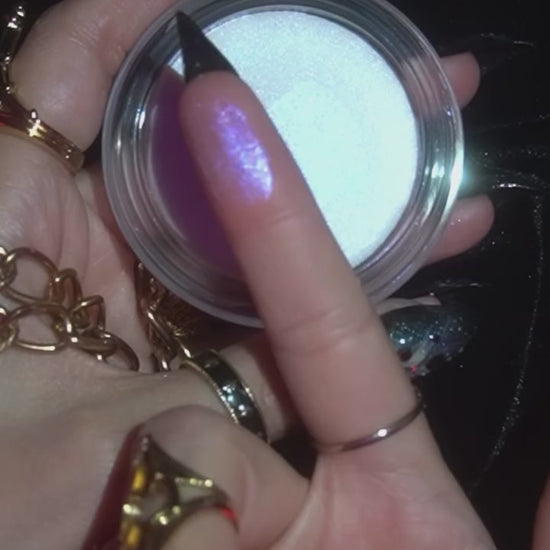 Opening the Phantom jar and swatching the cream on the back of the hand