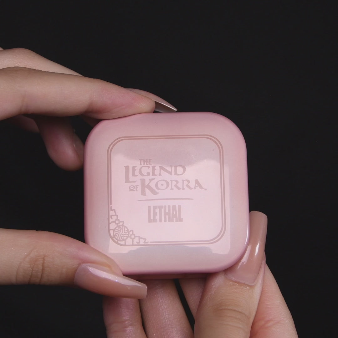 Video of the Pabu blushlighter opened in hand, with a close-up of the embossed pan and a coppery peach shade swatched on a fingertip