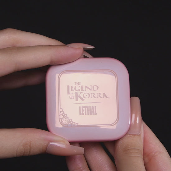 Video of the Naga blushlighter opened in hand, with a close-up of the embossed pan and arm swatches of the lilac and pearl white shades