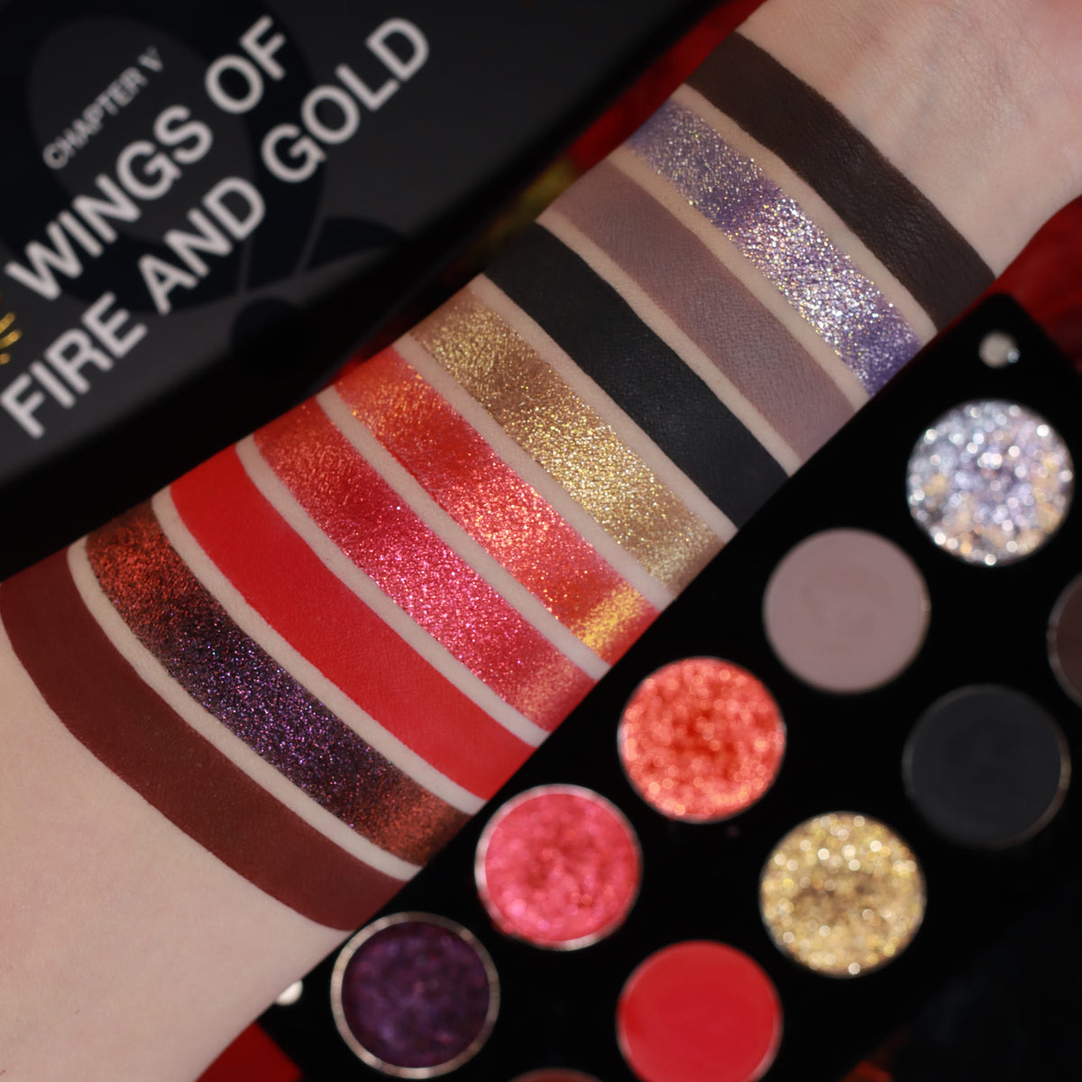 Ten swatch stripes on a fair arm, from lilac sparkle and greys to reds and burgundy, beside the open palette and the Chapter V box title.