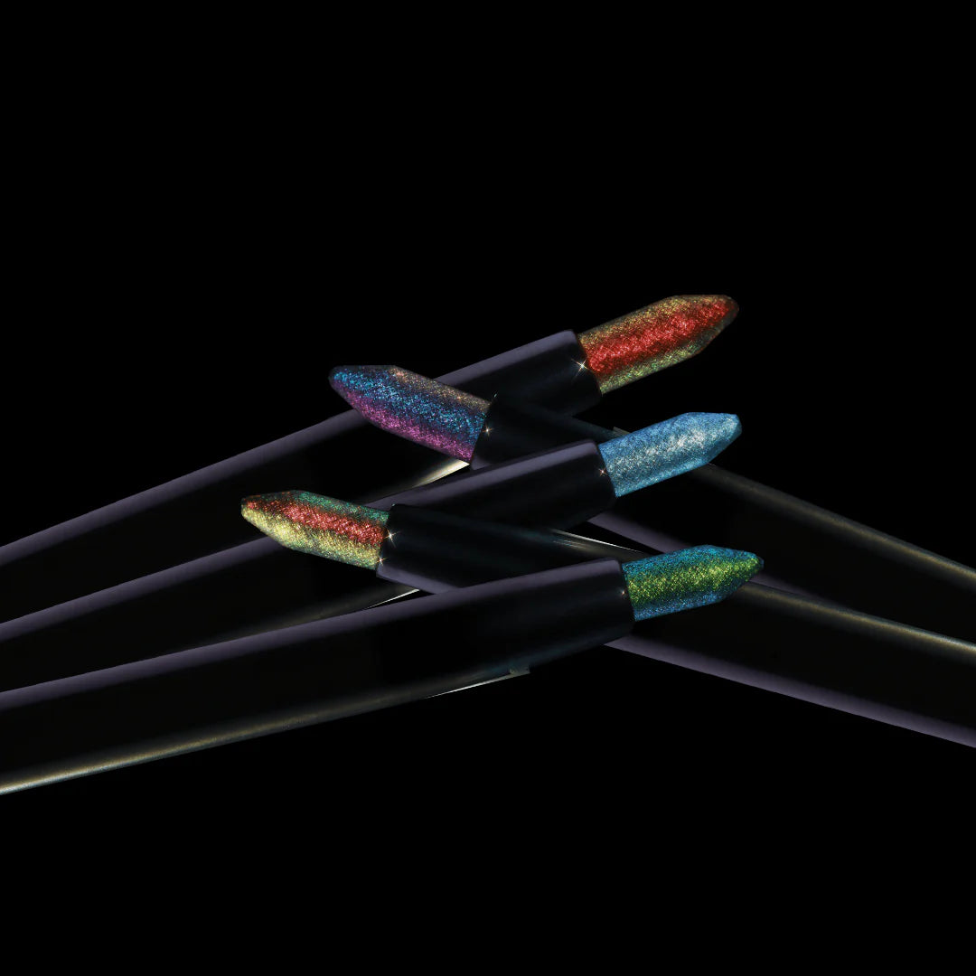 Five Question Beauty Multichrome Eyeliner Pencils fanned out against black background, showing multichrome tips in pink-blue, green-red, red-gold, blue, and teal-gold