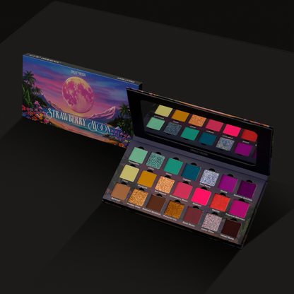 Closed box showing the tropical sunset artwork beside the open palette on black, all 21 pans and the lid mirror in view
