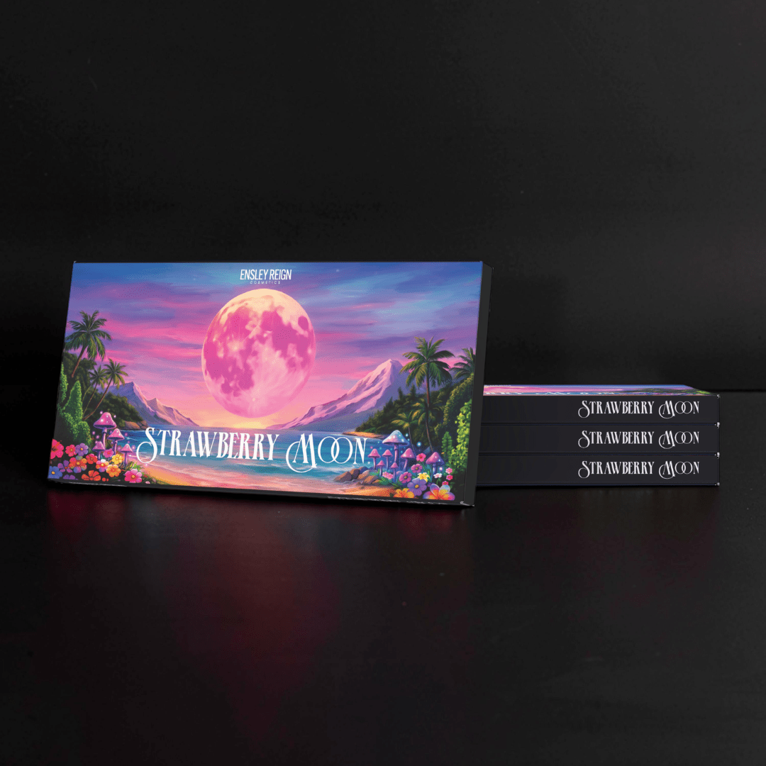 Closed box upright showing the pink moon, palms, and mushrooms artwork, with three more stacked behind it