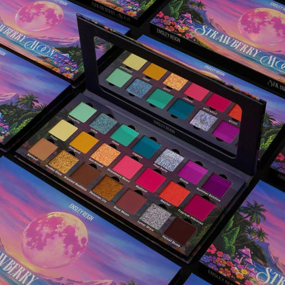 Open palette among rows of closed ones, tropical sunset lid artwork with a pink moon, 21 pans labelled from Tranquility to Velvet Dune