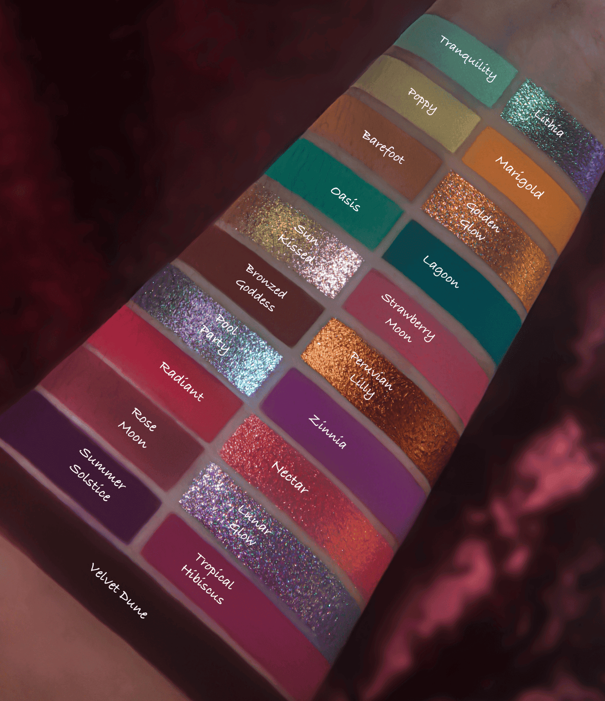 All 21 shades swatched on light skin in three columns, named from Tranquility through Velvet Dune