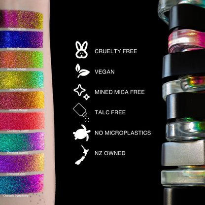 Question Beauty Multichrome Loose Pigment swatches on arm for nine shades alongside stacked jars, with cruelty free, vegan, mined mica free, talc free, no microplastics, and NZ owned icons