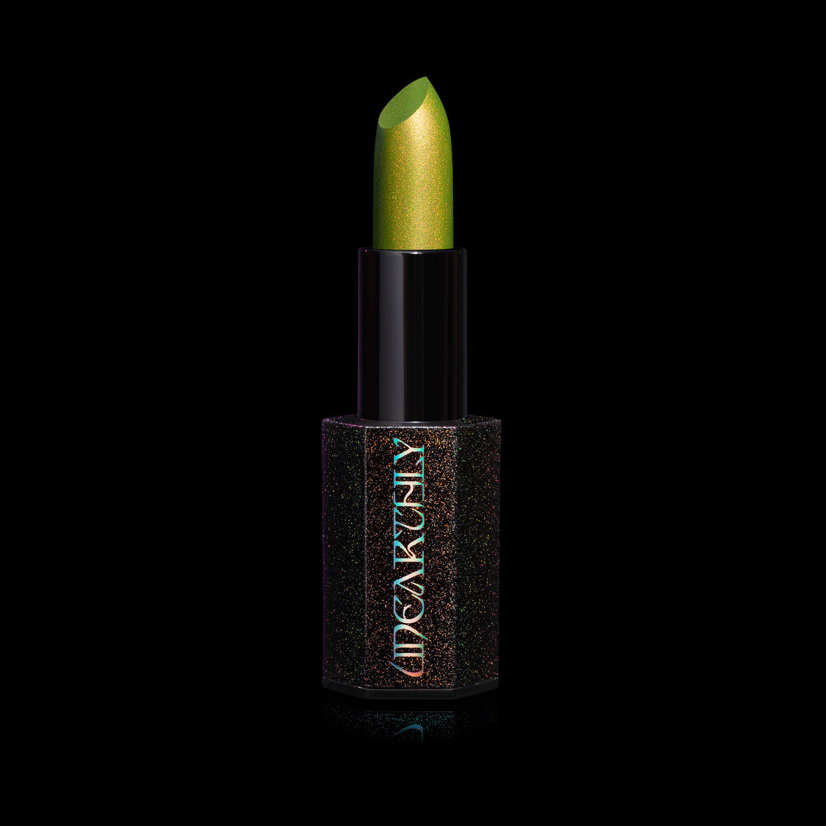 Fright Night Menacing Metal lipstick by Unearthly Cosmetics in Creature Feature, open in its black sparkle hexagonal tube: chartreuse green with gold shimmer