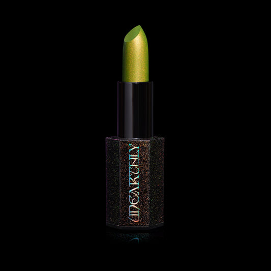 Fright Night Menacing Metal lipstick by Unearthly Cosmetics in Creature Feature, open in its black sparkle hexagonal tube: chartreuse green with gold shimmer