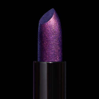 Final Cut bullet close-up: violet base with dense pink sparkle and a blue sheen at the cut edge