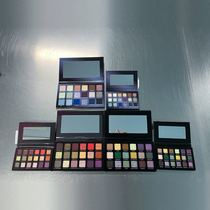 The Mini Gargoyle palette beside the full-size Gargoyle on the top row, with Just a Taste and Not Normal and their minis below, on a steel table