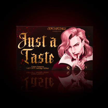 The Just a Taste palette box from Unearthly Cosmetics, vampire cover artwork, in a red glow