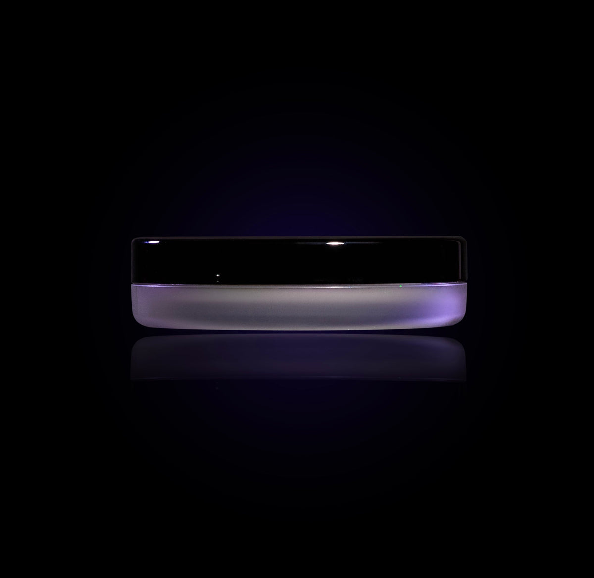 Phantom jar closed, seen from the side: frosted lilac base and a glossy black lid