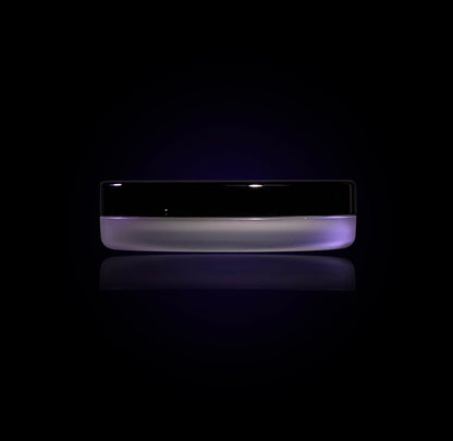 Phantom jar closed, seen from the side: frosted lilac base and a glossy black lid