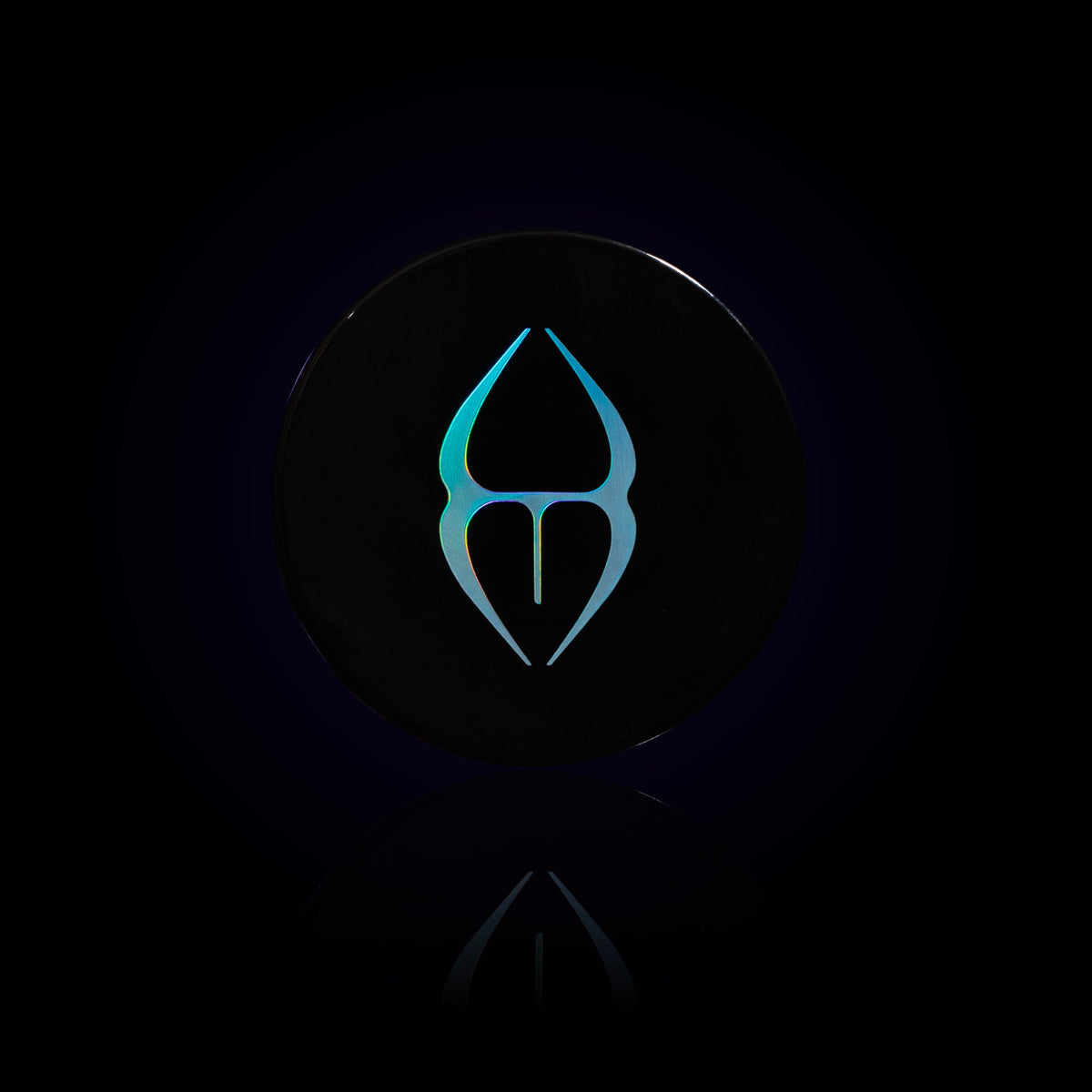 Phantom lid from above: black with the iridescent Unearthly emblem