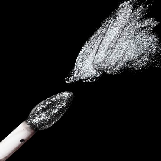 Gunmetal lip gloss swatch and applicator wand by Unearthly Cosmetics