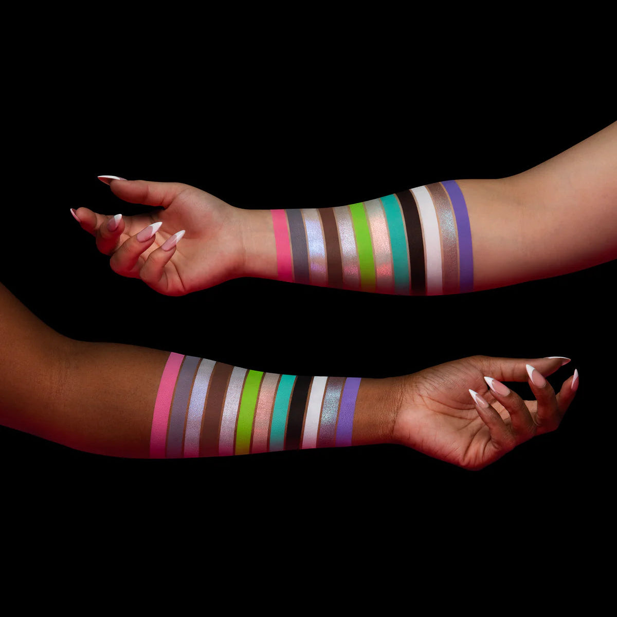 Woeful Whimsy palette by Unearthly Cosmetics - all 12 shades swatched on two arm skin tones showing Bubblegum, Gumdrop, Taffy, Fairy Floss and more