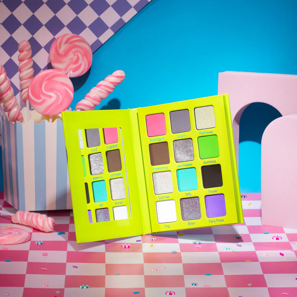 Woeful Whimsy eyeshadow palette by Unearthly Cosmetics - open neon green palette showing 12 shades including Bubblegum, Gumdrop, Taffy, and Fairy Floss